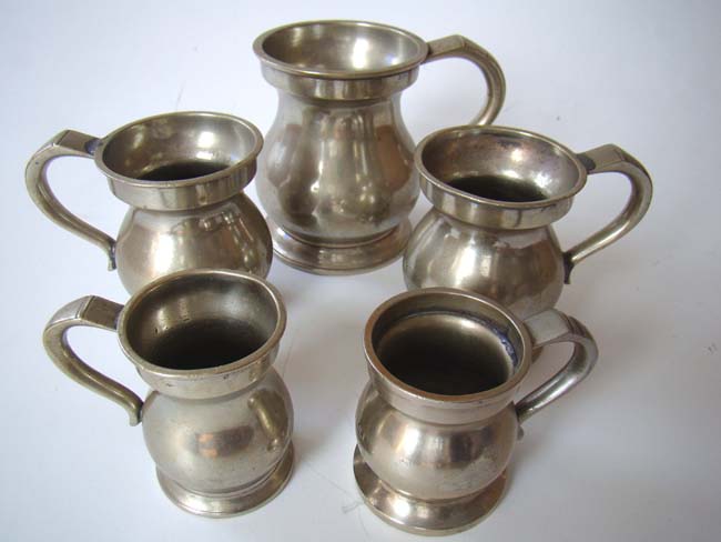 A fine collection of 19th century pewter tavern measures from the Crown Inn, Great Yarmouth, Norfolk, England, circa 1830-1850